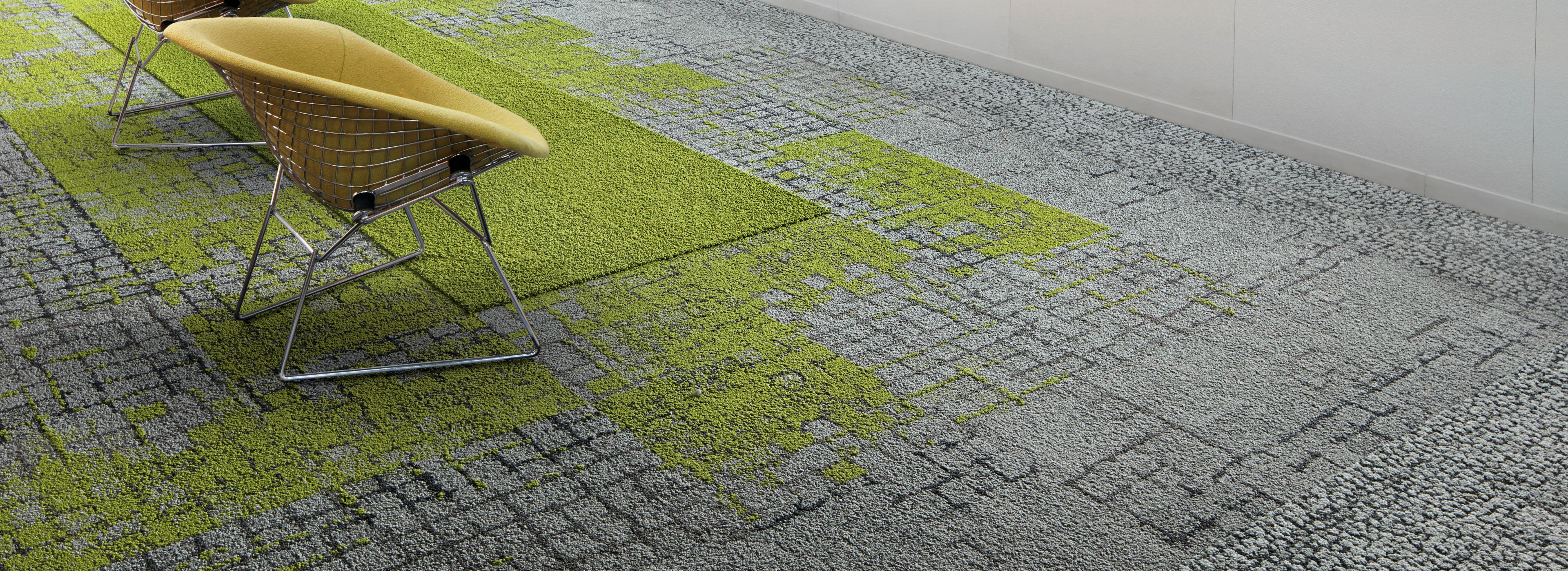 Interface Kerbstone, Moss in Stone, and Moss carpet tile with HN830 and HN840 plank carpet tile in seating area with three chairs facing wall with pictures imagen número 1